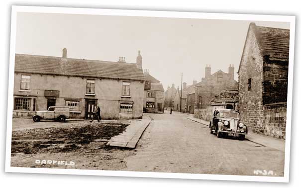 The row of houses in the fore of this shot of Darfield has now been demolished, but the one just visible behind it can still be seen today and houses the Maurice Dobson Heritage Centre.