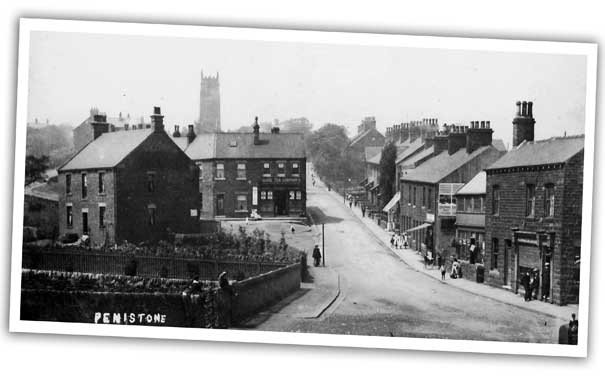 A view up Church Hill, Penistone showing the dignified tower of the church of St John the Baptist in the background. Completed in the Middle Ages, this striking landmark is by far the oldest building in Penistone.